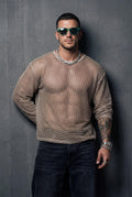 Front view of an oversized beige mesh sweatshirt worn by a muscular man. Sheer fabric reveals the chest and body underneath. Relaxed oversized fit designed for gay club wear, Berlin nightlife, circuit parties, and underground events. Statement piece for confident men who want breathable, sensual, and bold party clothing.