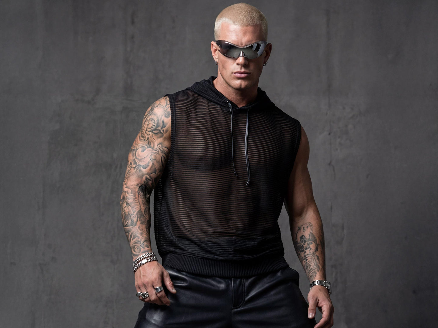 Black hooded sheer tank top men front view showing semi-transparent mesh with metallic stripes and sleeveless design. Perfect festival outfit for rave culture, pride events, and club nights. This breathable mesh top features urban edge with hood detail ideal for LGBTQ+ celebrations, Burning Man, or beach parties. Lightweight construction catches light beautifully for gay clubwear, queer fashion statements, and summer streetwear adventures.