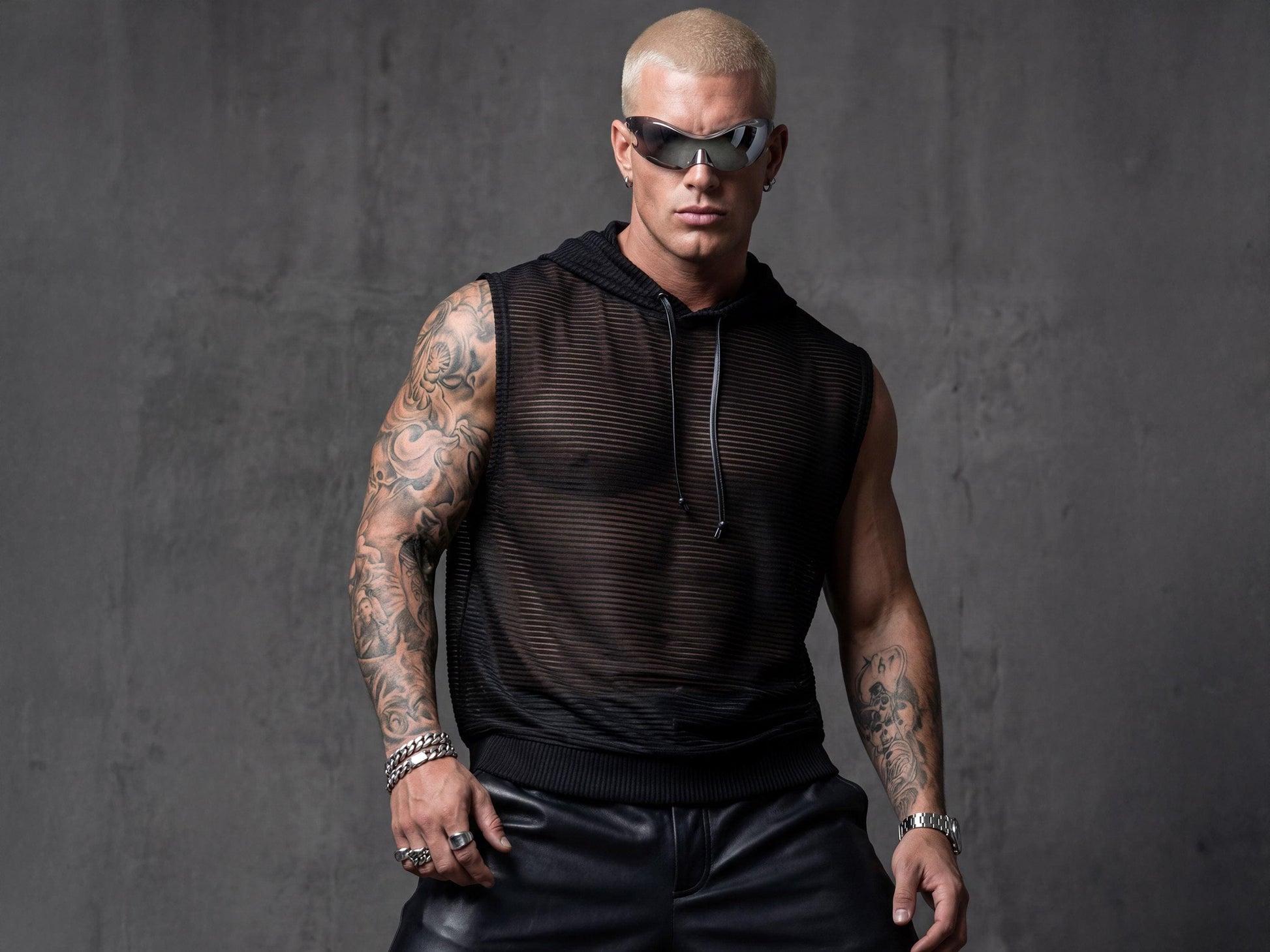 Black hooded sheer tank top men front view showing semi-transparent mesh with metallic stripes and sleeveless design. Perfect festival outfit for rave culture, pride events, and club nights. This breathable mesh top features urban edge with hood detail ideal for LGBTQ+ celebrations, Burning Man, or beach parties. Lightweight construction catches light beautifully for gay clubwear, queer fashion statements, and summer streetwear adventures.