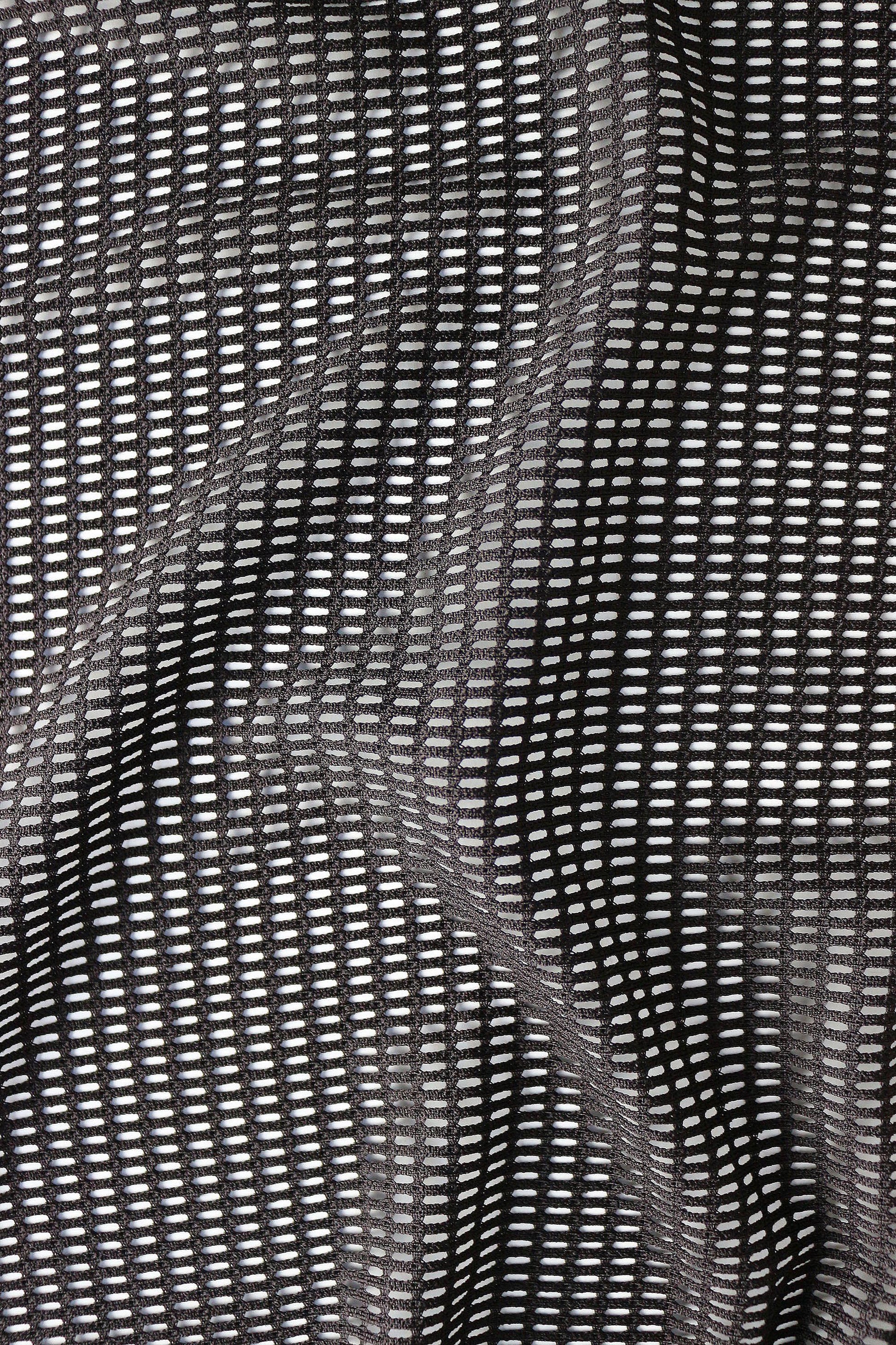 Close-up detail of breathable mesh fabric texture in black for lightweight rave shorts men