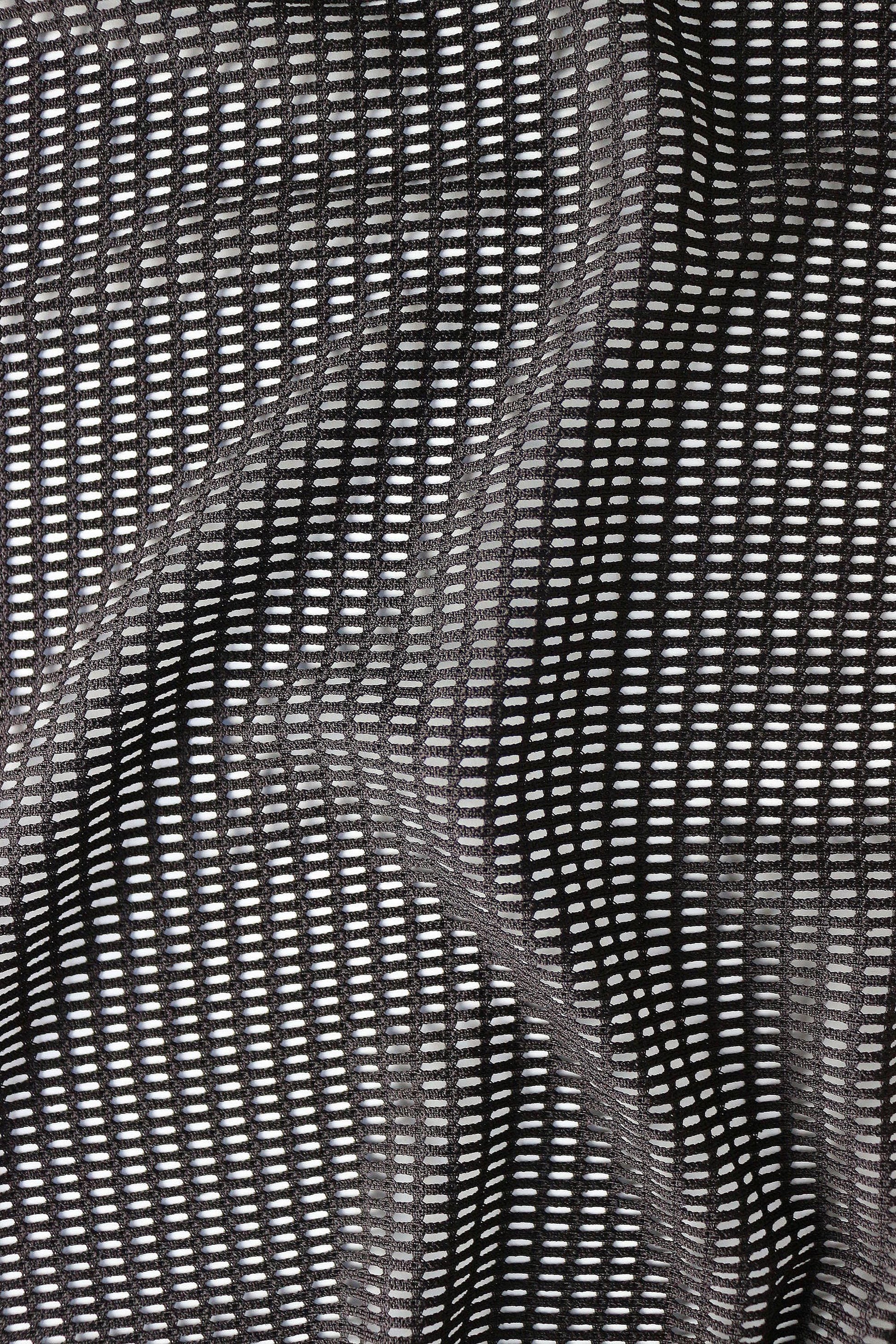 Close-up detail of breathable mesh fabric texture in black for lightweight rave crop top men