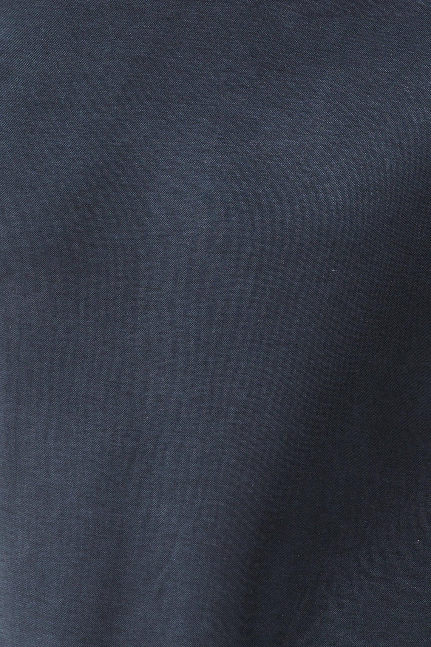 Close-up detail of navy blue premium modal fabric showing soft texture and faux leather trim construction. Designer t-shirt material combines 70% modal 30% polyester for exceptional breathability and drape. This crew neck tee fabric resists fading while getting softer with every wash. Quality men's fashion textile with contrast leather-look edging at collar and sleeves for elevated casual wear.