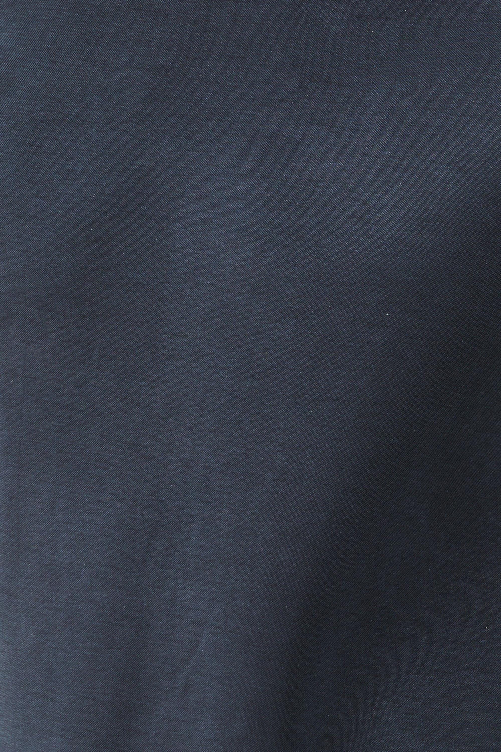 Close-up detail of navy blue premium modal fabric showing soft texture and faux leather trim construction. Designer t-shirt material combines 70% modal 30% polyester for exceptional breathability and drape. This crew neck tee fabric resists fading while getting softer with every wash. Quality men's fashion textile with contrast leather-look edging at collar and sleeves for elevated casual wear.