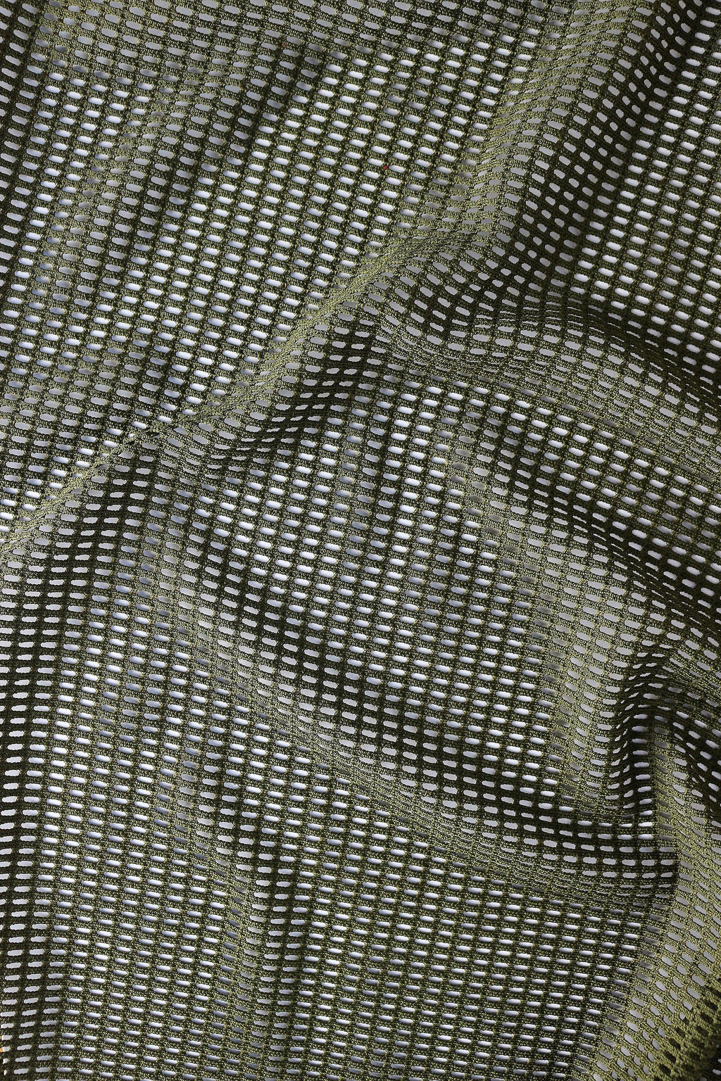 Close-up detail of breathable mesh fabric texture in olive green for lightweight rave crop top men