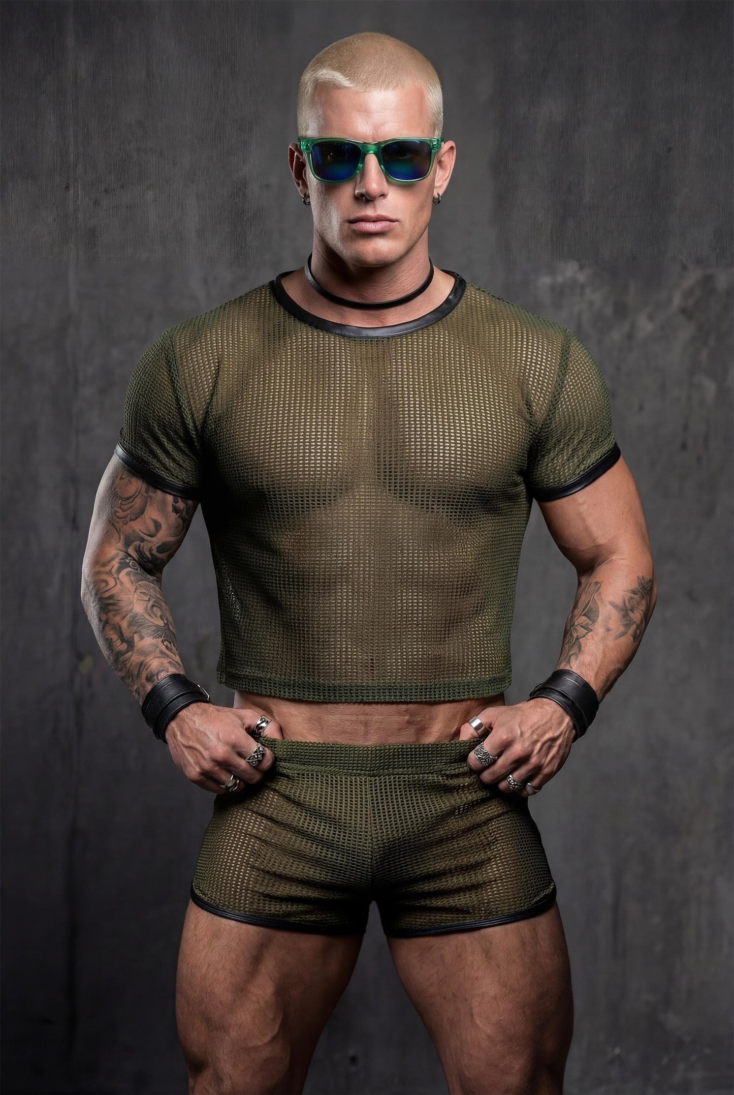 Front view military green mesh crop top and transparent shorts matching set on masculine model - PIEL bold gay pride outfit for circuit parties rave festivals - see-through athletic menswear bundle with contrast black trim details - queer fashion statement for techno clubs underground events - olive green color perfect for alternative style fetish parties burning man outfits - breathable sheer fabric designed for lgbtq community celebrations
