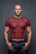 Men's metal chain suspender harness front view, muscular torso, red crop top, black pants, festival wear