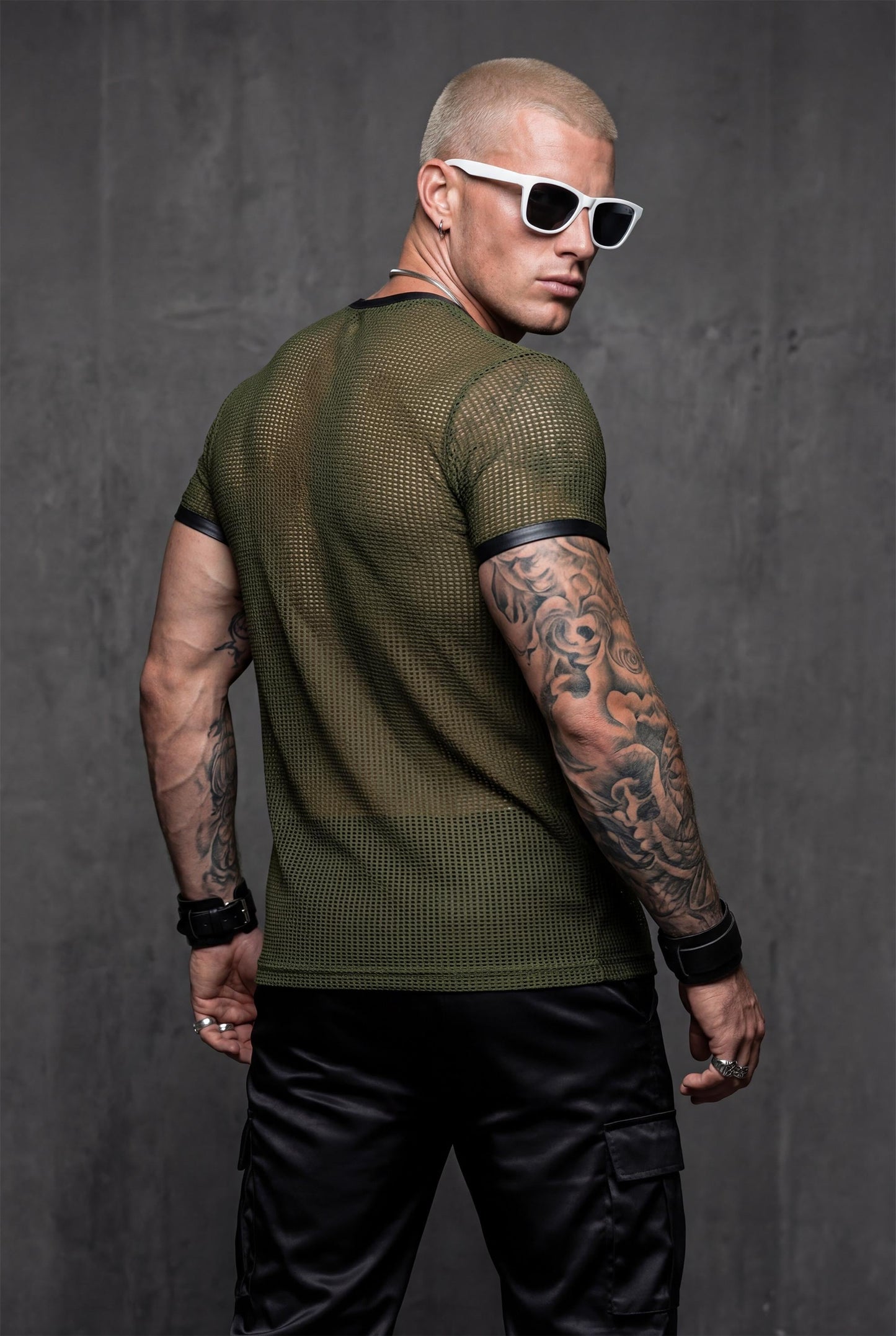 Sheer mesh t-shirt back view in army green showing transparent fabric for gay club outfit