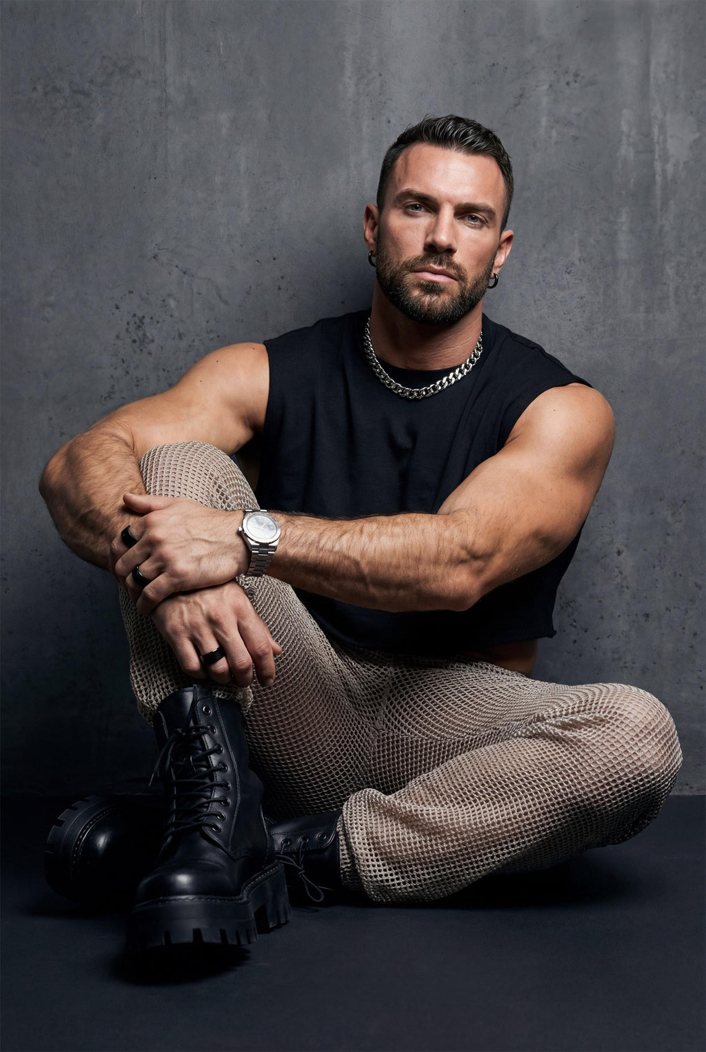 Beige see-through knit mesh jogger pants men with elastic cuffs and drawstring waist, perfect for gay casual wear, rave festival outfit, and relaxed summer style. Breathable open-knit fabric offers ventilation while creating unique textured look. Available in beige and black. Ideal for beach parties, festival lounging, pride events, and casual clubwear. Elastic waistband ensures comfort. Statement piece for men who embrace bold transparent fashion with laid-back confidence and individuality.