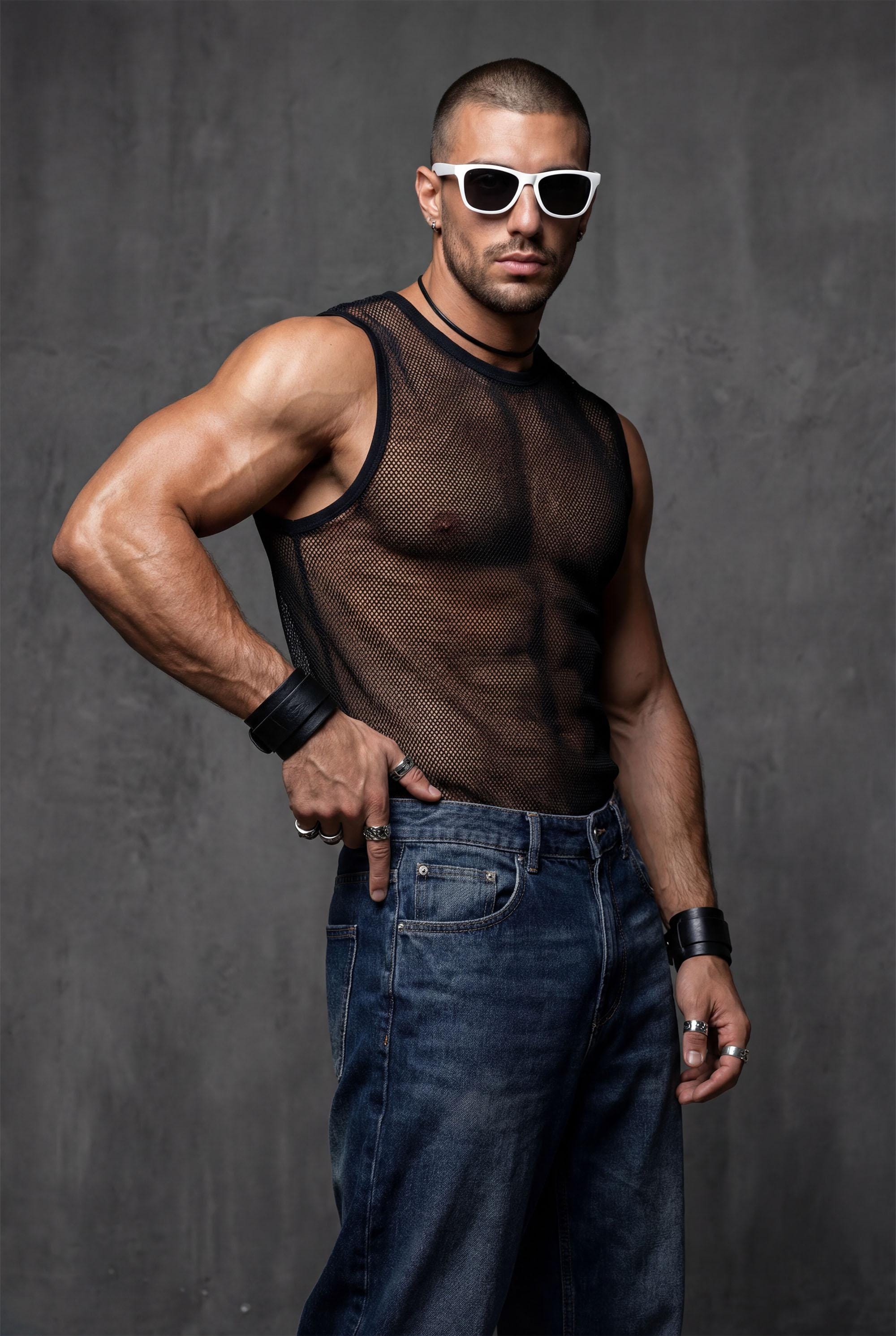 Side profile of unisex transparent mesh tank showing fitted sleeveless construction and see-through nylon fabric. Perfect gay pride outfit for festivals, rave wear, and club nights celebrating body confidence. This black sheer tank delivers breathable comfort for all genders at LGBTQ+ events, circuit parties, or underground venues. Bold queer fashion combining provocative style with functional design for dancers, performers, and style rebels.